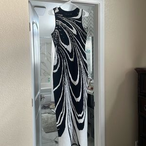 Long black and white dress, soft, thick material and its tighter at the top